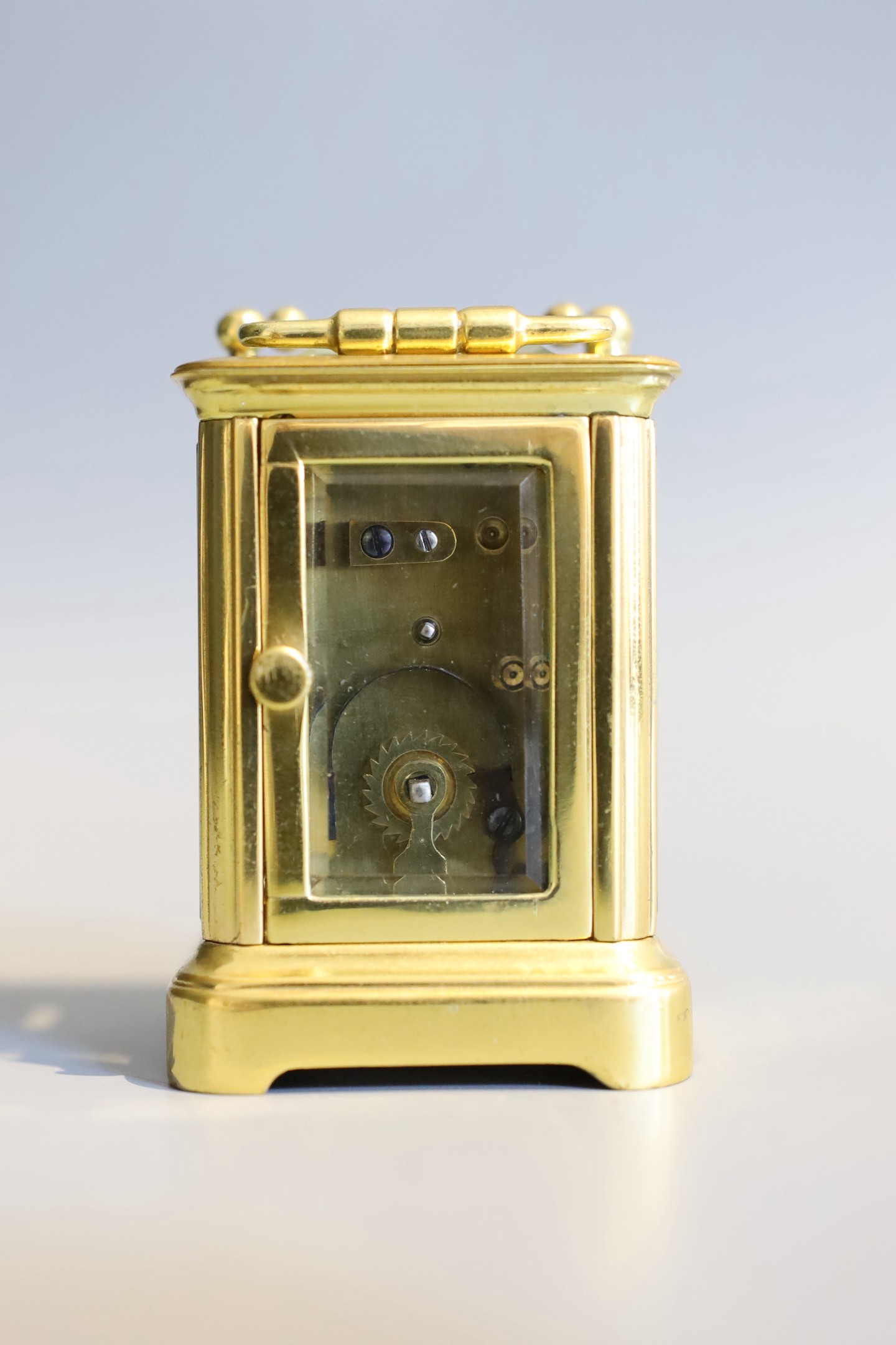 A 19th century French lacquered brass miniature carriage timepiece, height 7cm